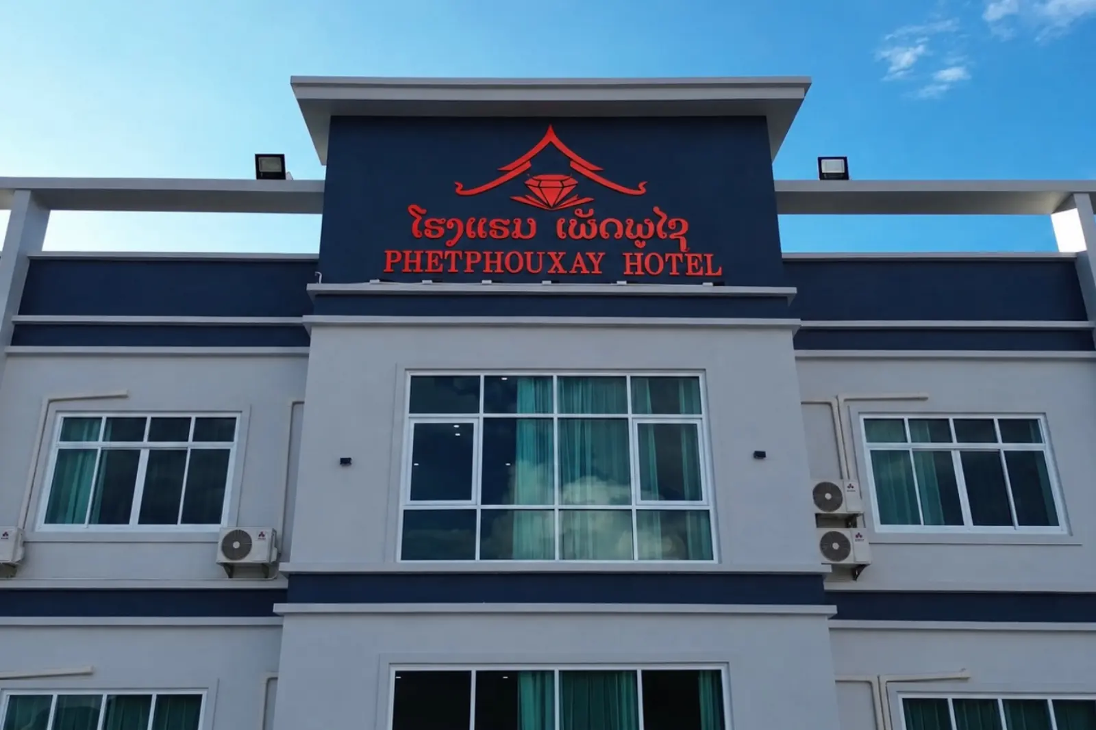The Phetphouxay Hotel sign on the front of the building