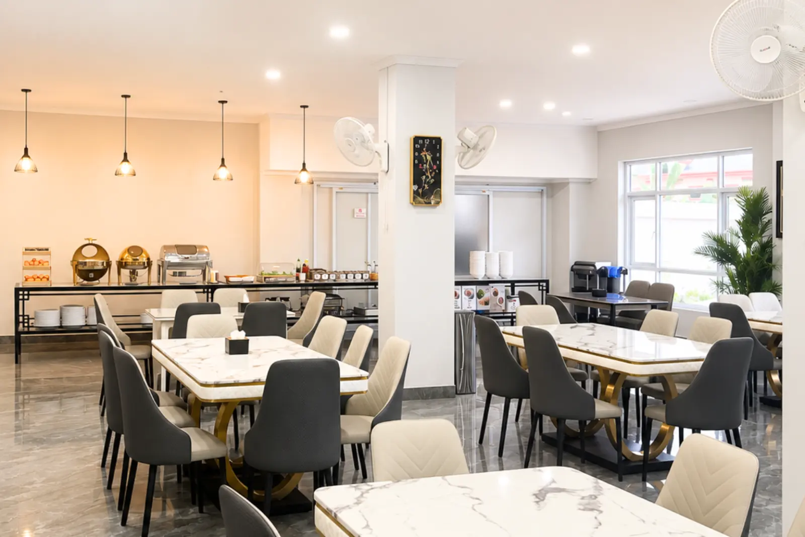 The dining room seen end to end, with the buffet counter along the wall