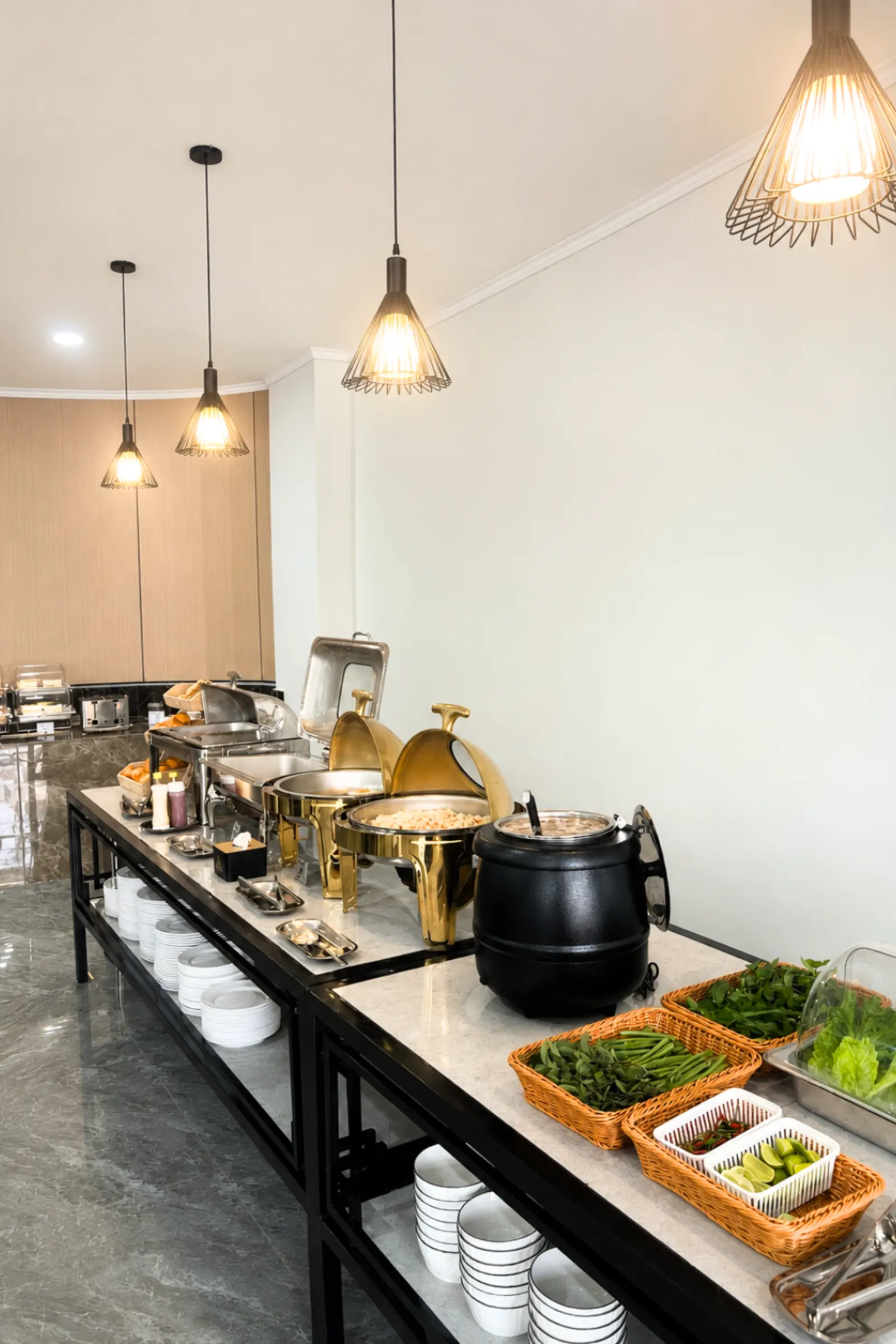 Buffet counter with the soup kettle, fresh herbs and condiments