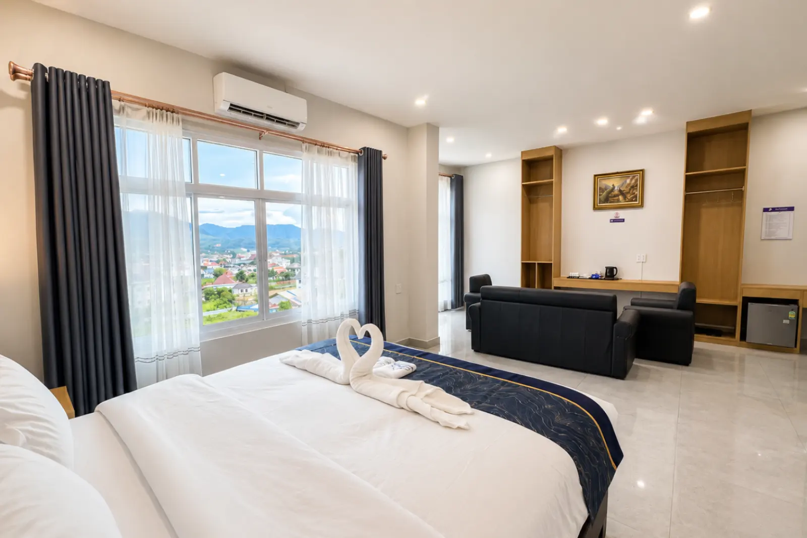 VIP room bed and lounge with mountains through the window