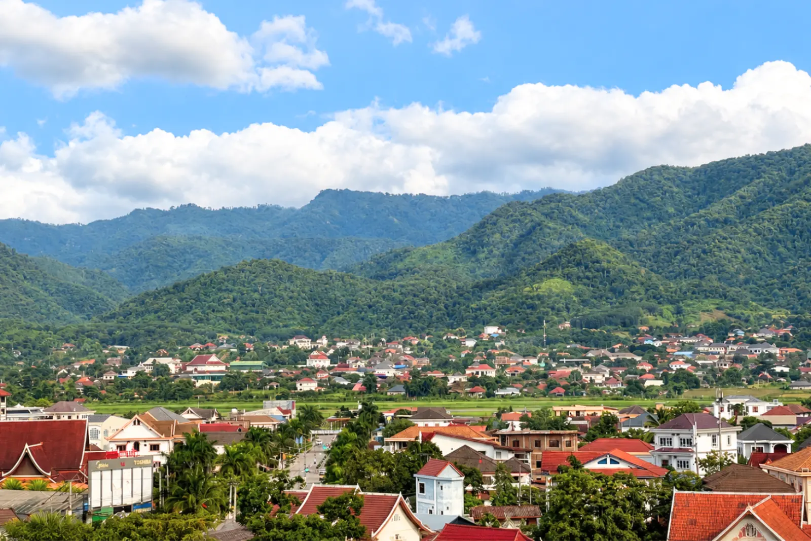 The town of Muang Xai spread out below a long mountain range
