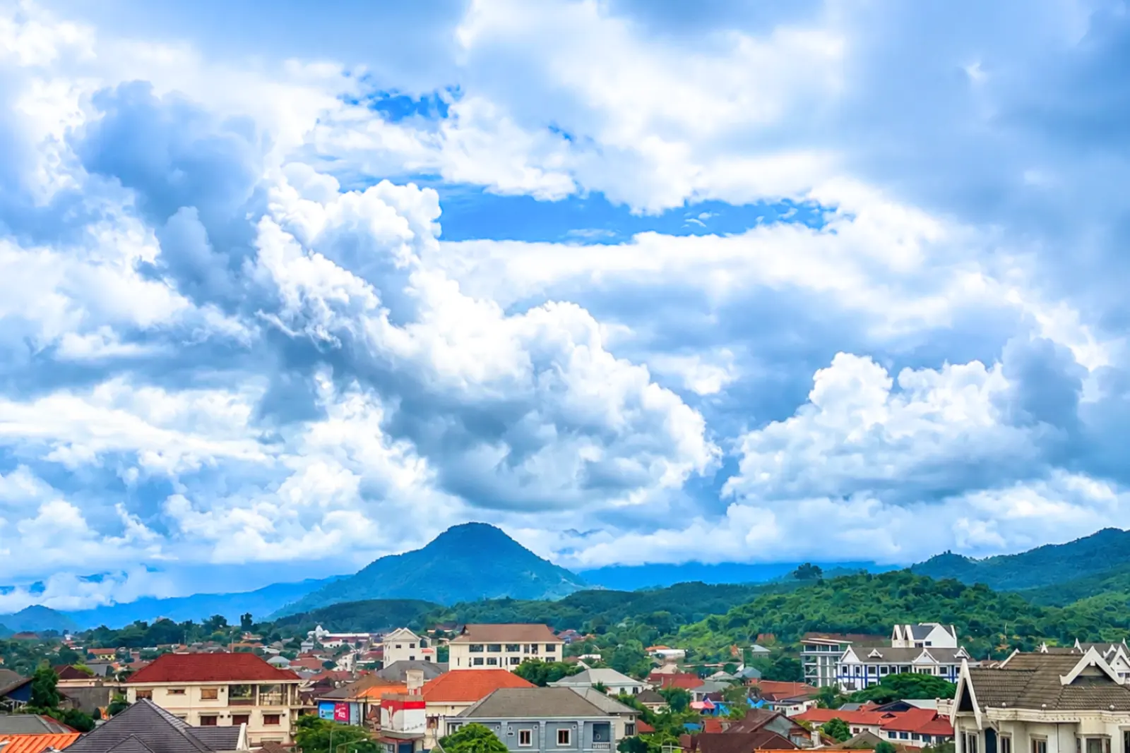 Towering clouds above the mountains behind Muang Xai